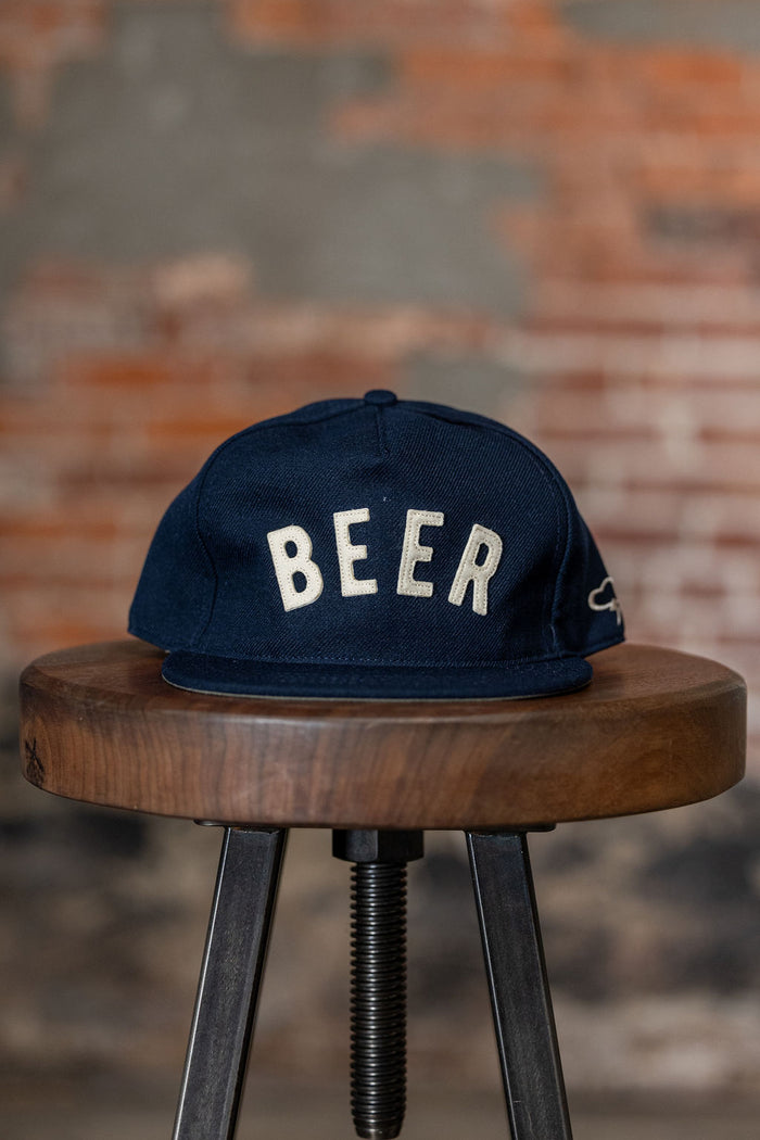 Ampal Creative Beer II - Snapback. on stool front profile