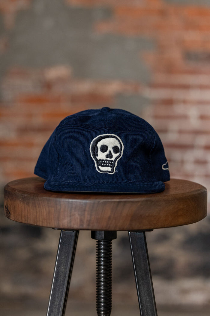 Ampal Creative The Skull - Navy Snapback. on stool front profile