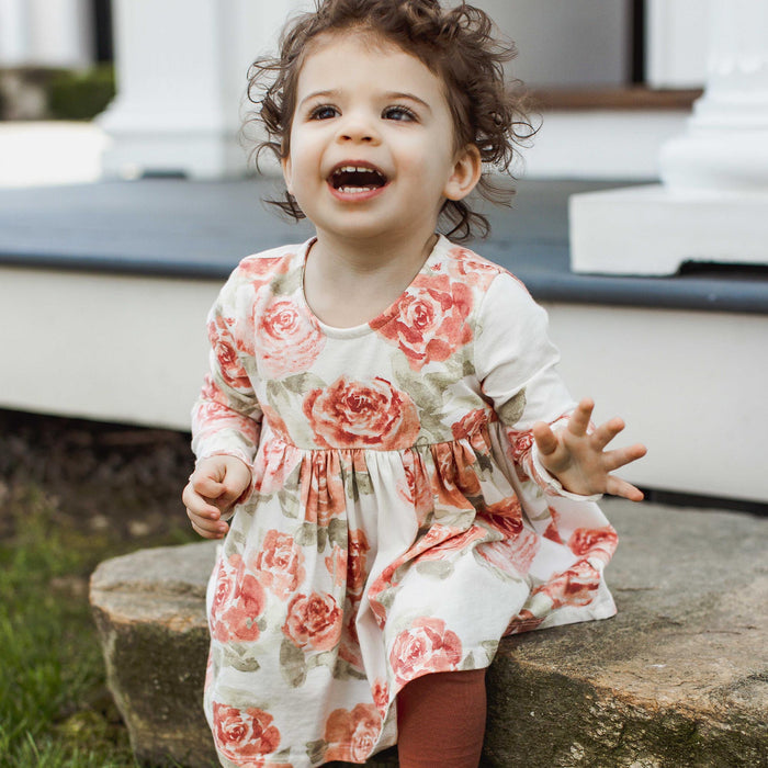 Floral tunic with round neckline, long sleeves, cream with pink rose print