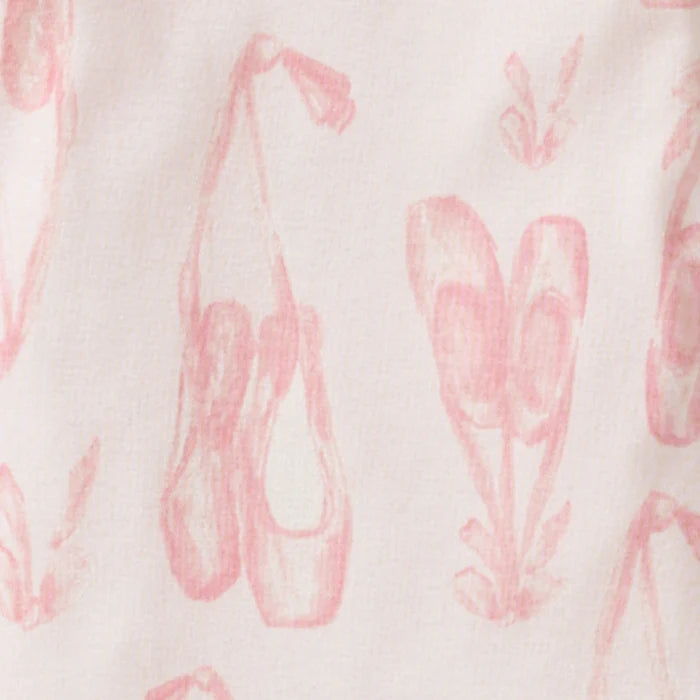 Close-up of white fabric with pink ballet slipper print