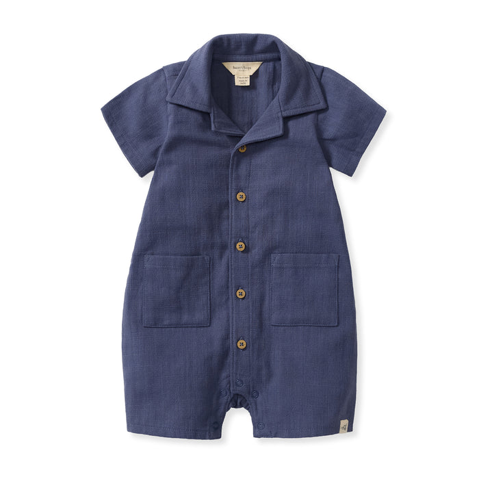 Navy checked gauze baby boy romper with button front and two chest pockets