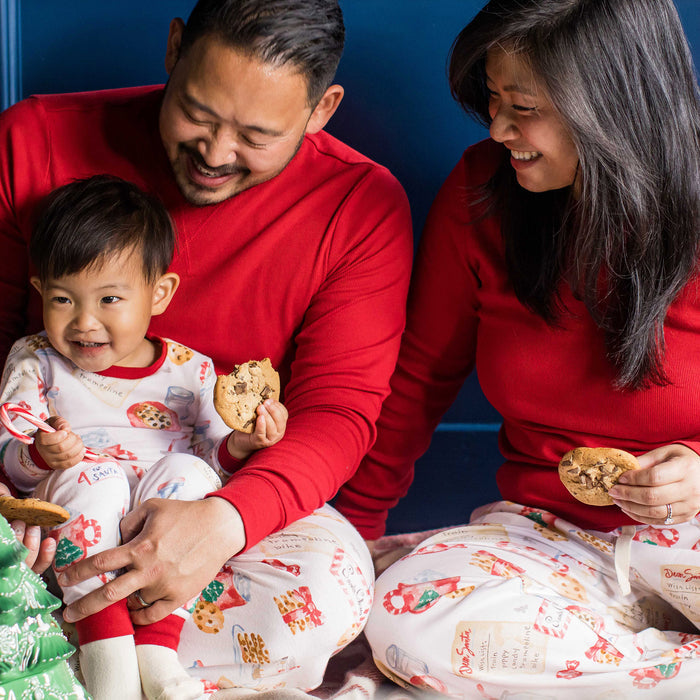 Kids organic cotton pajama set in white with colorful cookies, red cuffs and long sleeves