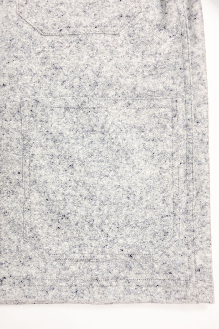 Dehen 1920 Chore Coat - Natural & Navy Heather Wool. close up of bottom pocket