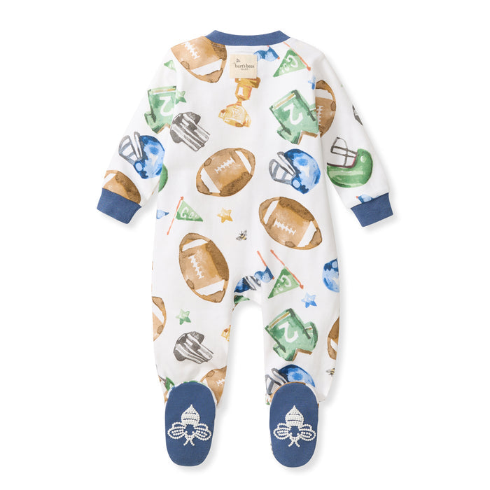 Football-print footed sleeper with navy cuffs and snap neck, organic cotton