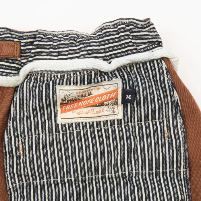 shorts laid flat on white, inside of back pocket detail