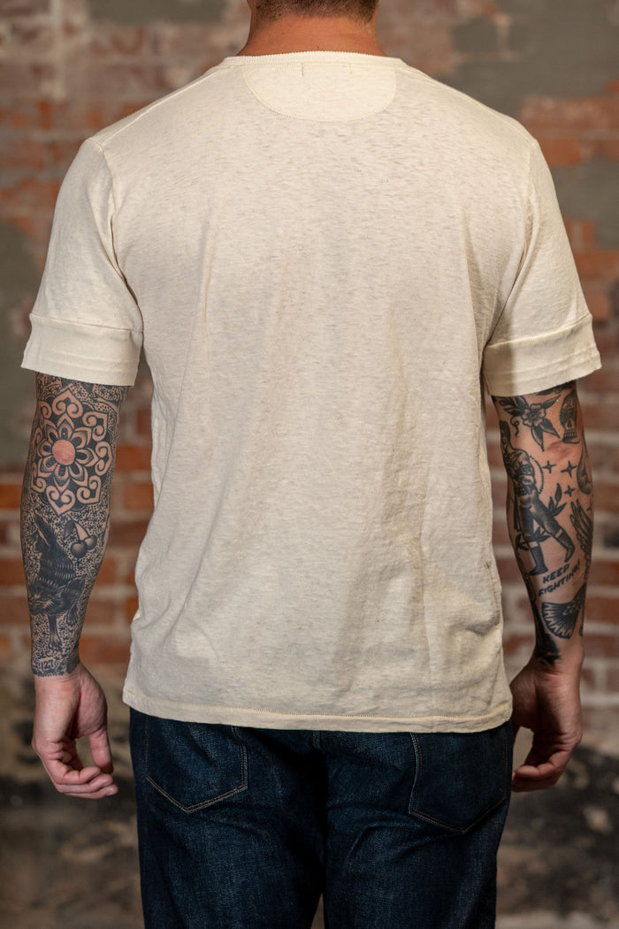 Man wearing the Freenote Cloth Fairmont Henley S/S - Natural from the back