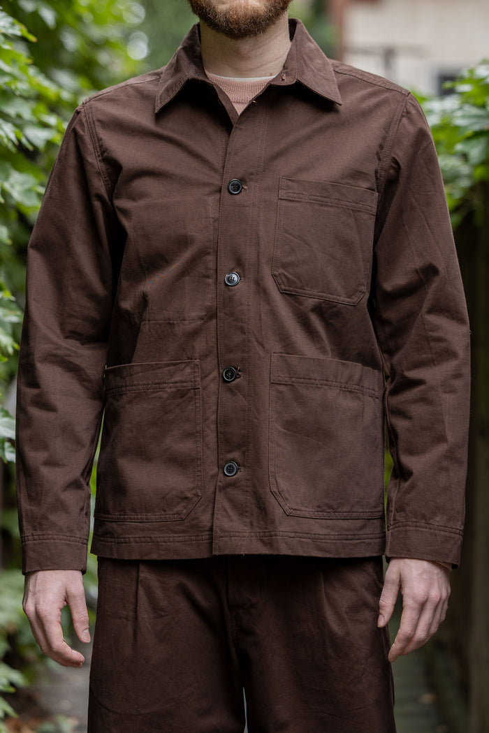 Hansen Garments Bendik Workwear Jacket - Chestnut - model shot - front facing - outside foliage background