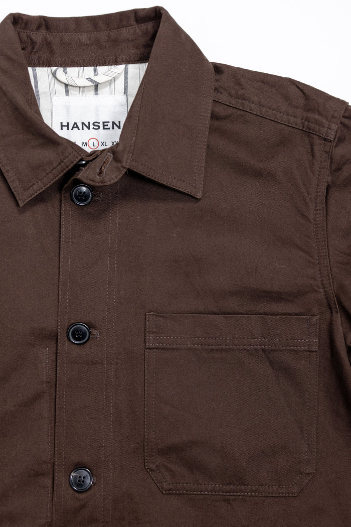 Hansen Garments Bendik Workwear Jacket - Chestnut - product shot - front facing - white background - close up detail of collar, buttons, and pocket