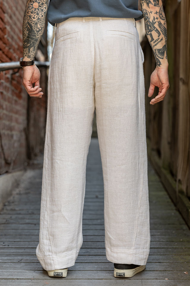 Hansen Garments Bobby Wide Pleated Trousers - Off White Gauze - model shot - waist down - back facing