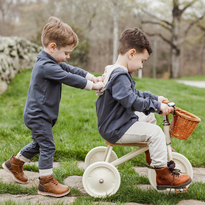 Hooded button-down shirt and beige pants set on child, dark blue jacket with front pockets
