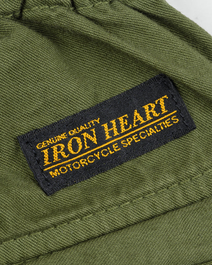 Olive mid length shorts back view laying flat closeup on black/yellow Iron Heart logo