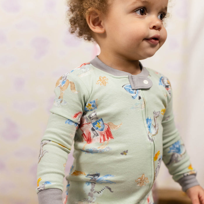 Light green organic cotton sleeper with button placket and knight-and-dragon print