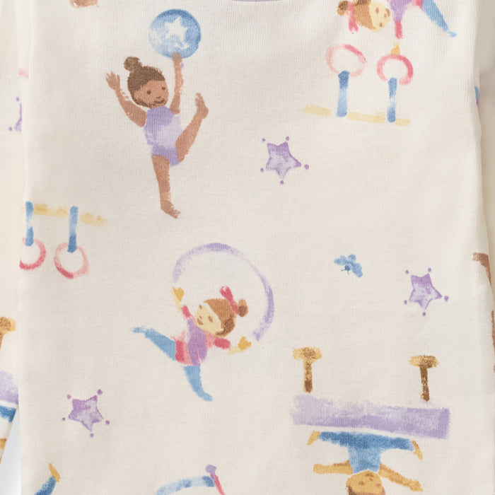 Cream footed sleep & play pajama with colorful gymnast print and stars