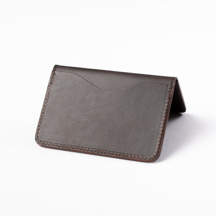 Obbi Good Label Kingsman Metro Flap Style Cardholder - Brown - A brown leather cardholder, displayed open, inside facing down, showcasing single external card slot against a white background