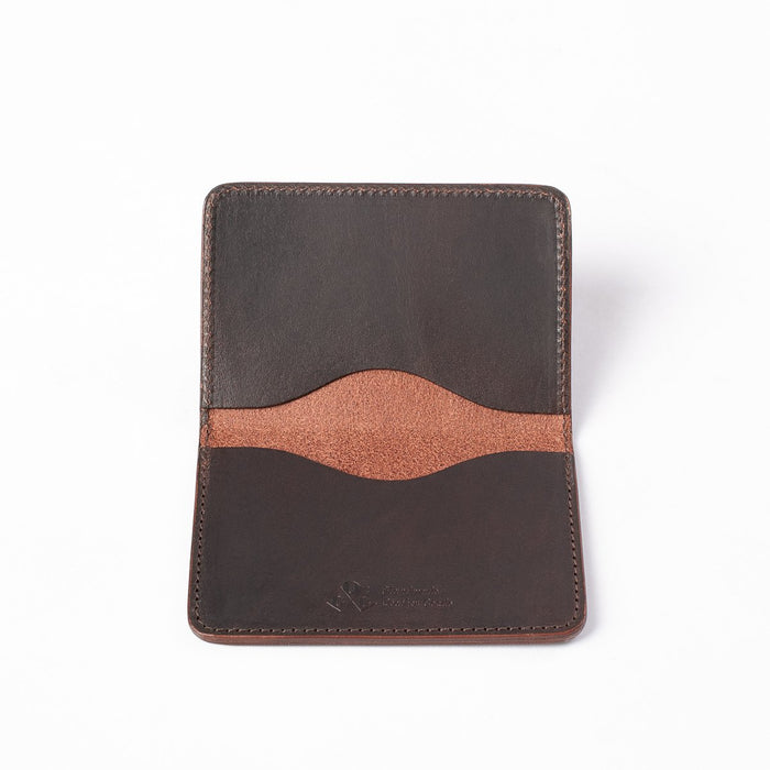 Obbi Good Label Kingsman Metro Flap Style Cardholder - Brown - A brown leather cardholder, displayed fully open, showcasing two internal card slots and embossed logo against a white background