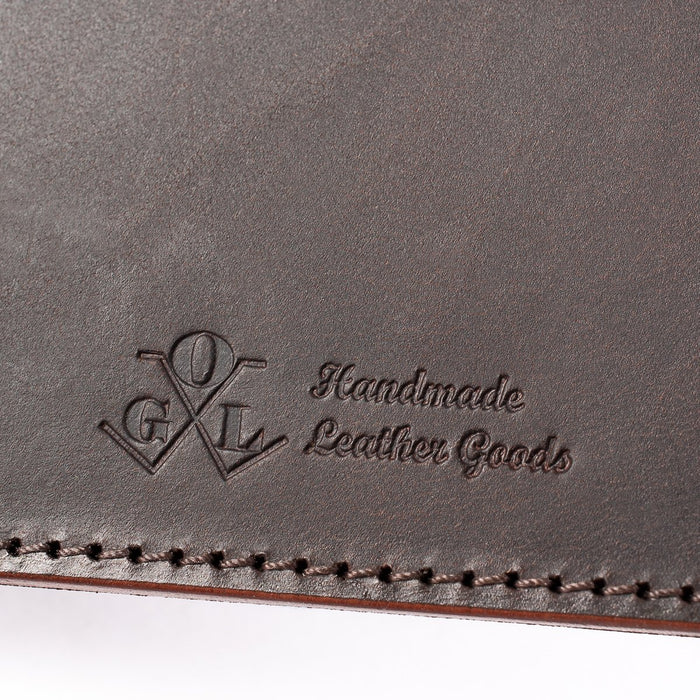 Obbi Good Label Kingsman Metro Flap Style Cardholder - Brown - Close up of logo inside of wallet against a white background