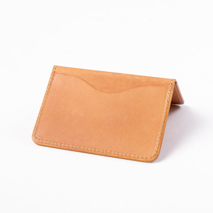 Obbi Good Label Kingsman Metro Flap Style Cardholder - Tan - A tan leather cardholder, displayed open, inside facing down, showcasing single external card slot against a white background