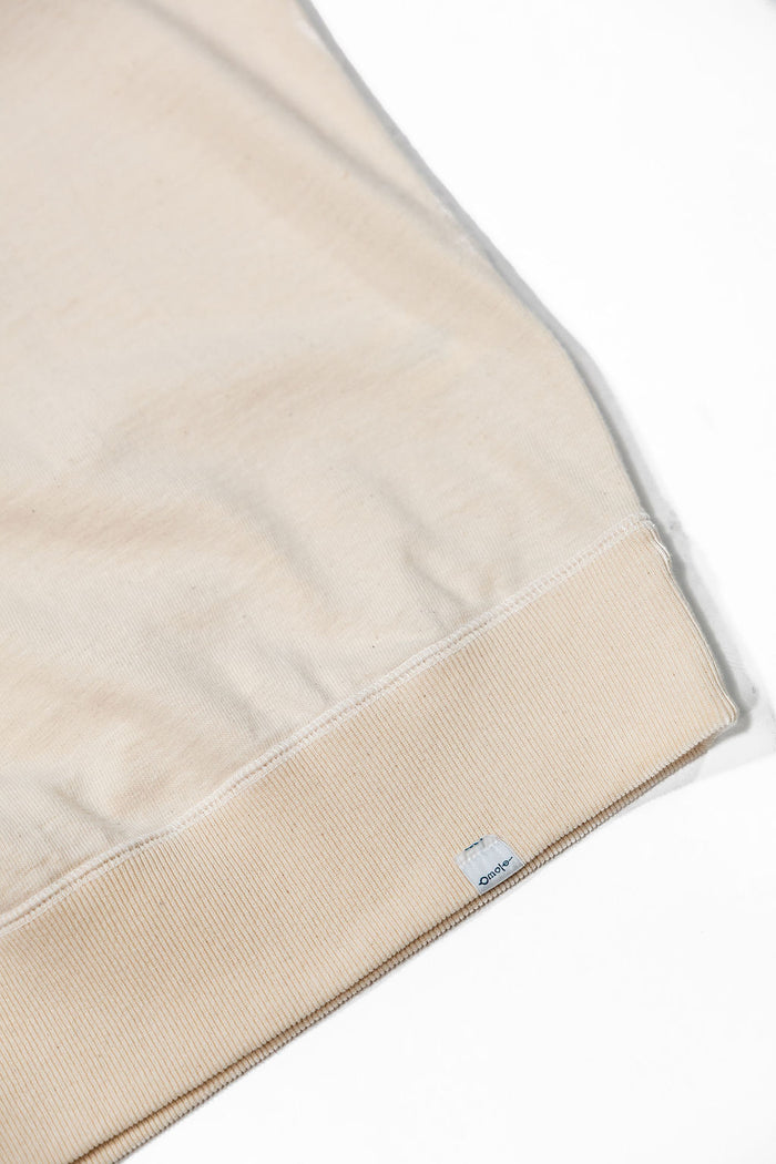 Omoto Denim 12.5oz Memphis Cotton T-Shirt - Natural. close up shot of bottom of shirt details