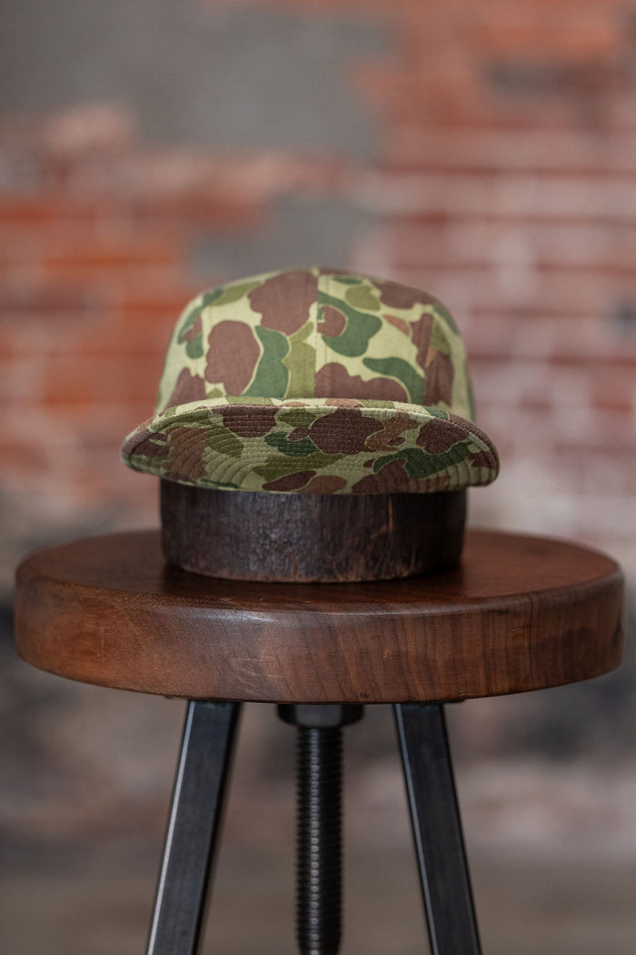 Papa Nui Hell Cat cap in green and brown Frog Camo, front view with bill flipped up