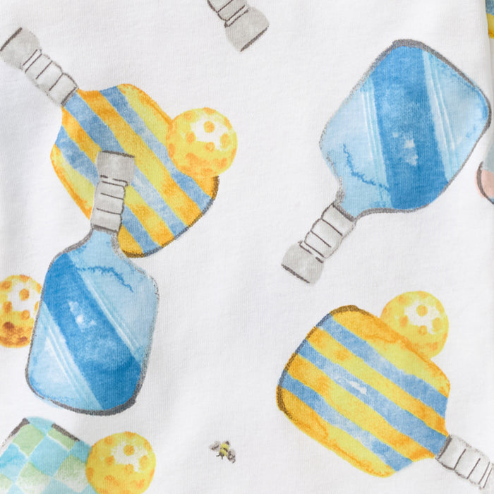 White organic cotton pajama top with blue and yellow pickleball-themed print