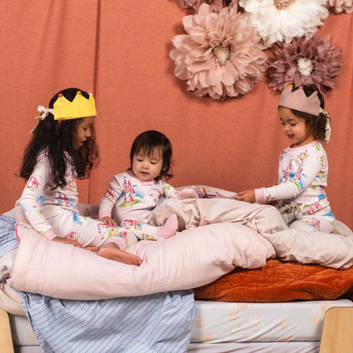 Organic cotton two-piece pajamas with colorful carousel print, long-sleeve top and pant cuffs
