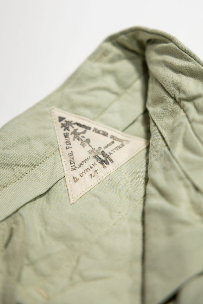 Seuvas 10oz Canvas 2-Tuck Shorts - Matcha. close up detail shot of inside tag