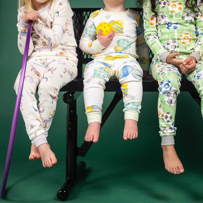 Green soccer-print two-piece pajama set on kids, long sleeves and long pants