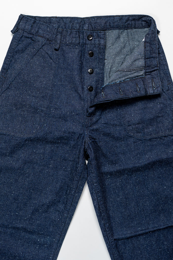 TCB Jeans Seamens Trousers - 10oz Neppy Denim Indigo One Wash. laid on back with buttons undone