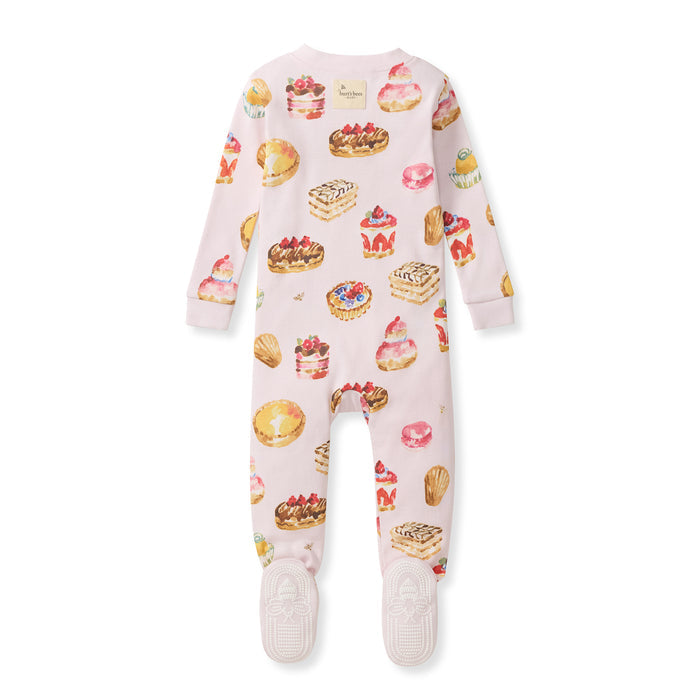 Footed organic cotton sleeper, long sleeves, pastel pink with colorful pastry graphic print.