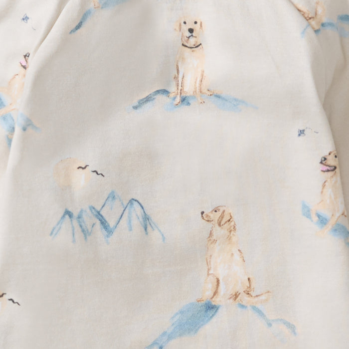 Light cream bodysuit fabric with scattered dog and mountain blue illustrations