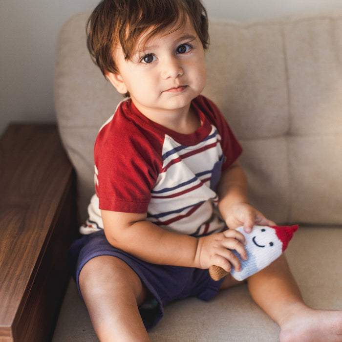 Boys striped raglan tee with burgundy sleeves and navy shorts, front view