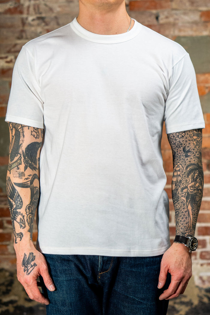 Whitesville WV73544 2-Pack T-Shirt - White - Man wearing a t-shirt facing forward on brick background