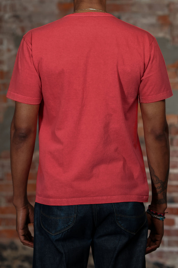 Whitesville WV79531 Pigment Dye Pocket T-Shirt - Red - On model wearing blue jeans, full shot of back with brick background