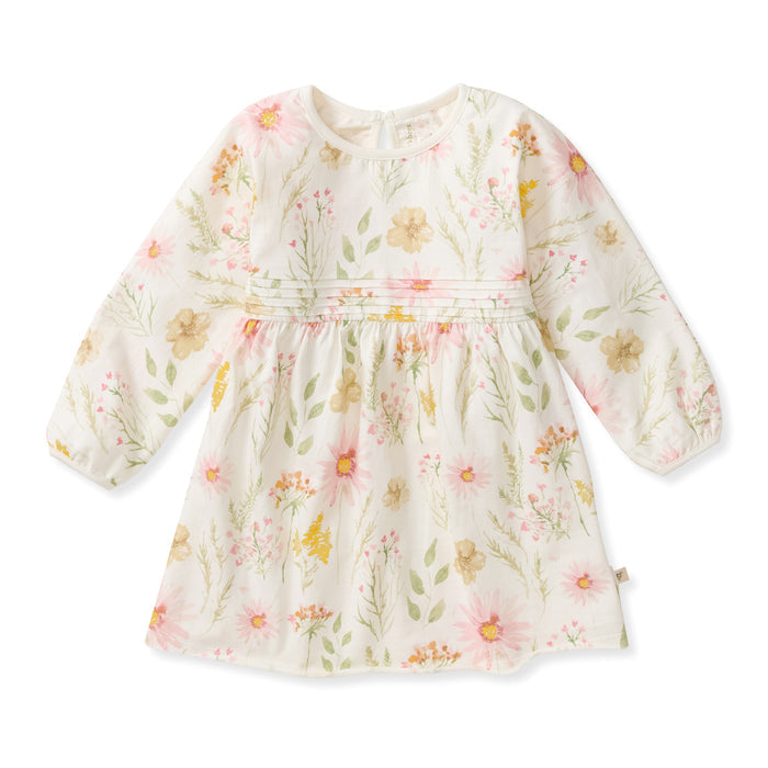 White long-sleeve floral dress with gathered yoke and flared skirt