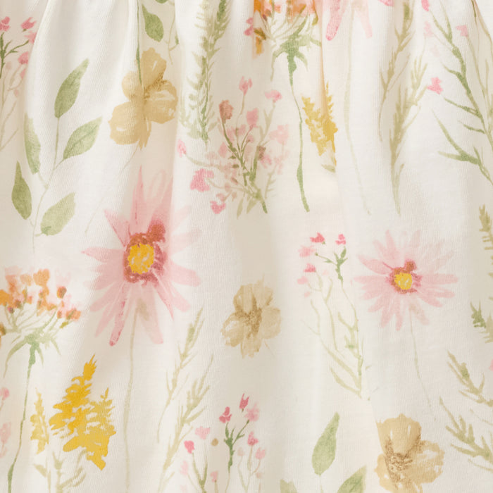 White floral dress fabric with scattered wildflower print