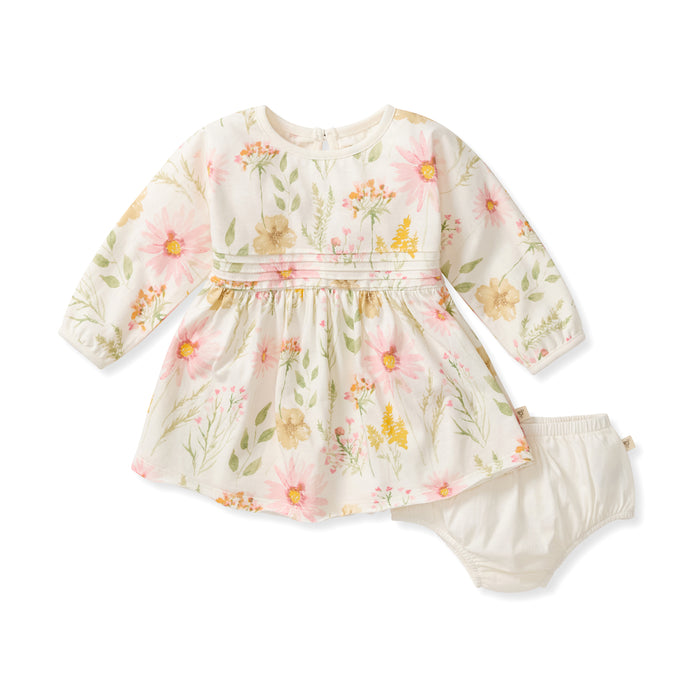 White long-sleeve floral dress with pleated bodice and tiered skirt, plus bloomers